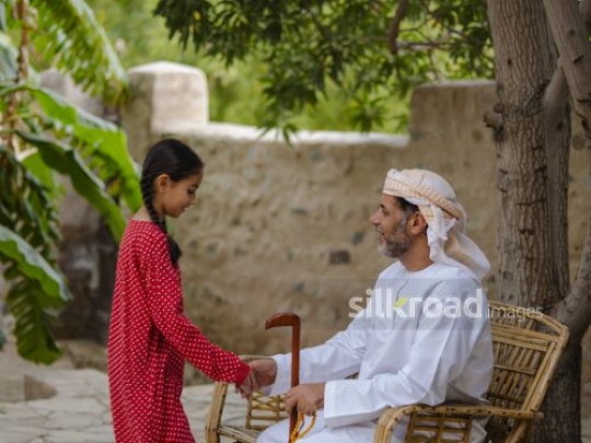 Girl greeting grandfather|-