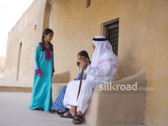 Kids joining grandfather outside|-