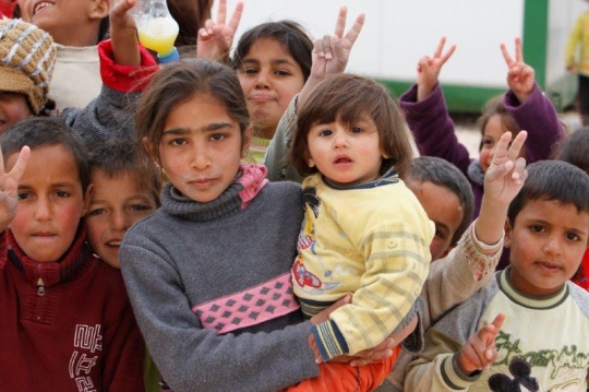 Syrian Kids show victory sign from Zaatari refugee camp for Syrian refugees