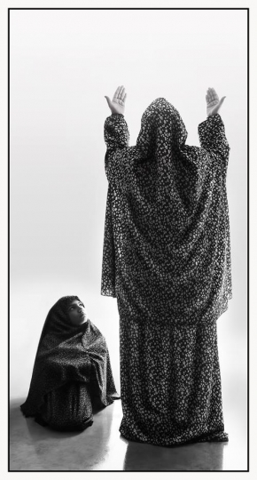 -Mother teaching her daughter how to pray 