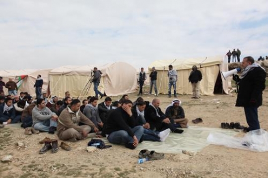 Group of Palestinian demonstrators and leader at Bab al-Shams or Gate of the Sun in Arabic, in a bid to draw attention to Israeli plans to boost settlement building in the West Bank area.