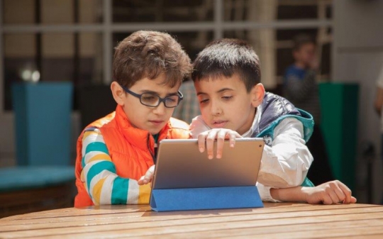 Boys Browsing Smart Tablet