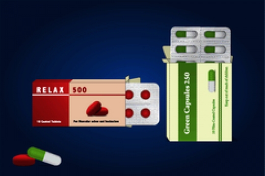 capsules and pills packed in blisters on blue background