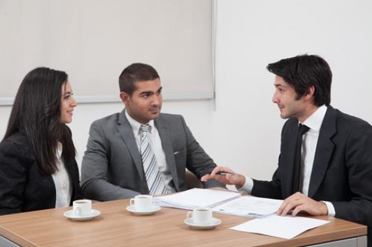 business people sitting at table in a meeting room