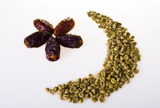 dates and coffee beans isolated in white background