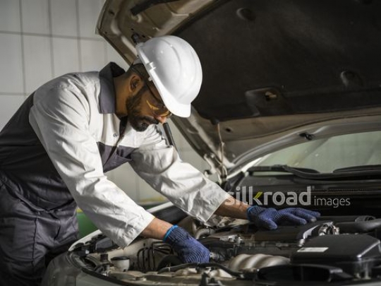 Mechanic Worker checking the oil |-