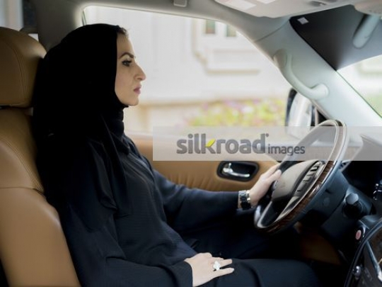 Arab Businesswoman sitting inside the car|