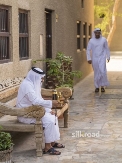Arab man walking towards his father|-