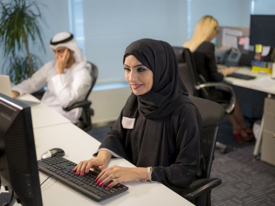 Woman sitting by her desk at the office|