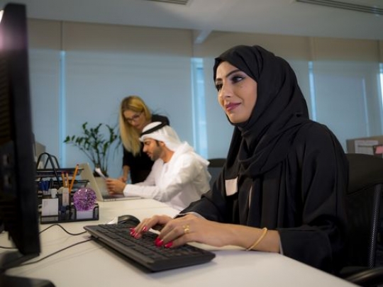 Woman working by her desk at the office|