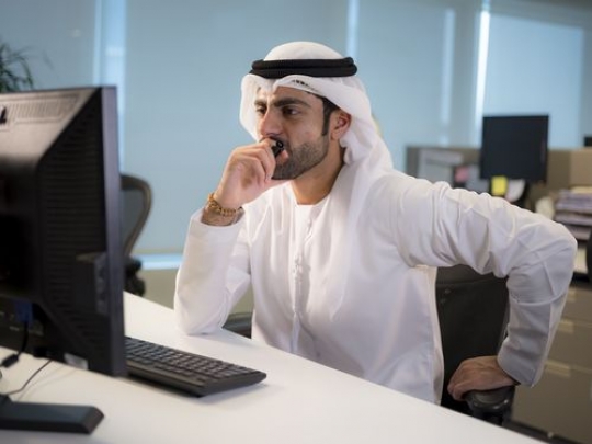 Hard working business man sitting by his desk|