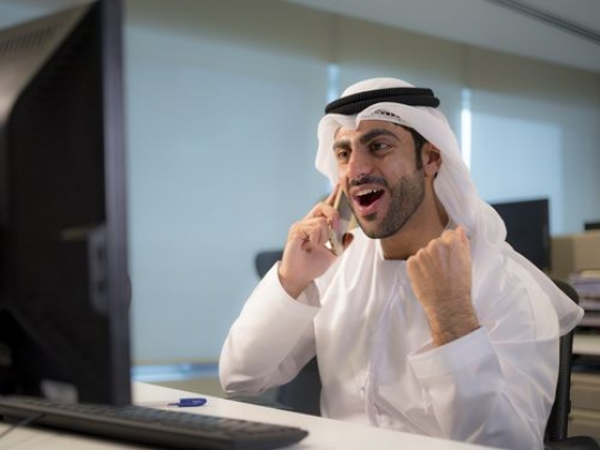 Business man is talking on the phone and excited|