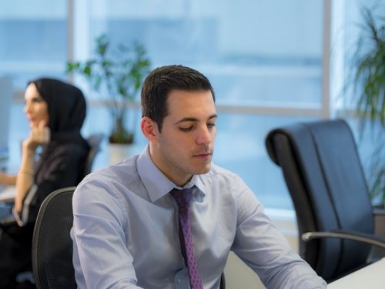 Business man sitting by the desk|-