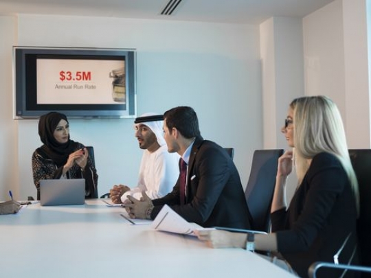 Business woman talking to employee during a meeting|-