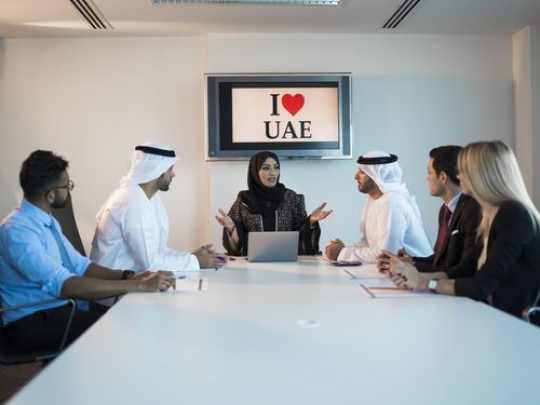 Employees during a meeting in a conference room|-