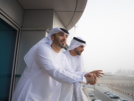 Employees standing outside and looking at the view