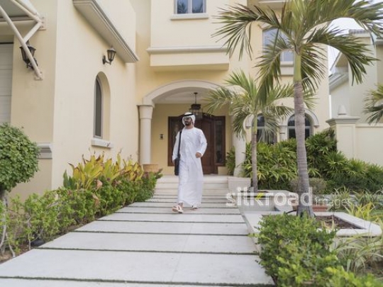 Middle eastern man walking alone outside |