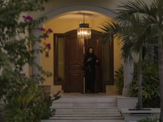 Arab woman leaving her home|-