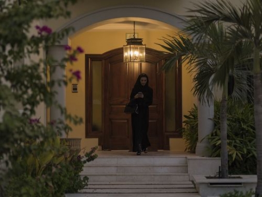 Arab woman leaving the house|-