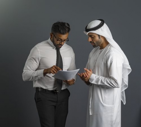 Business men talking to each other|