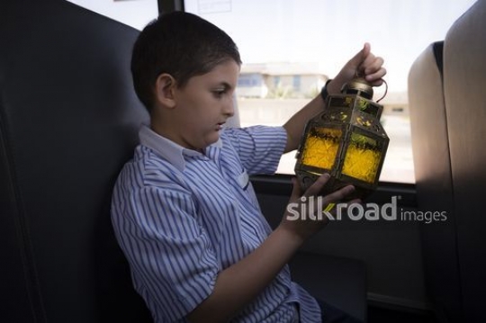 Middle Eastern student looking at the Ramadan Lantern|-