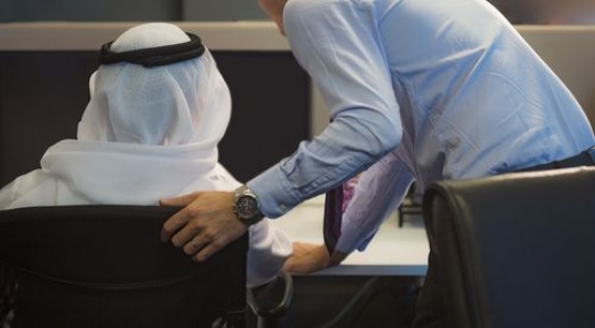 Back view of businessmen at the office working together|