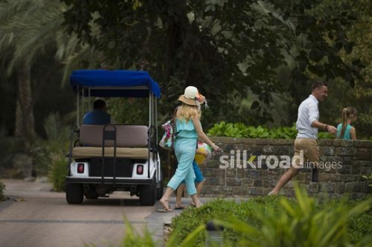Western family walking towards their room|-