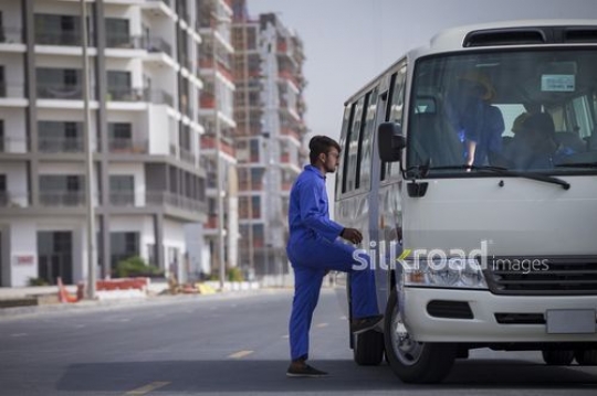 Construction Worker entering the bus|-