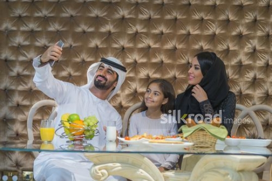 Middle Eastern family taking a picture together|