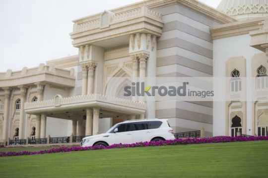 Four by Four white salon car parked|