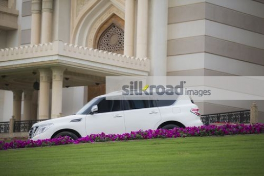 4 by 4 White Salon Car Parked|