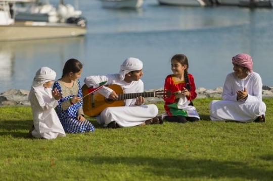 Arab teenagers and kids singing along for national day|-