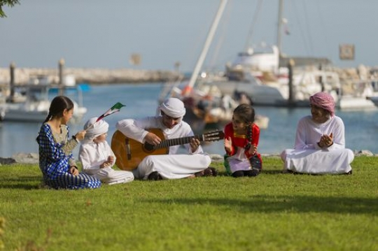 Middle eastern kids and teenagers celebrating national day|-