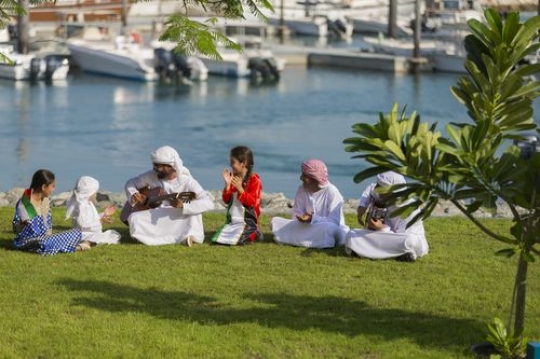 Family and friends dressed in the traditional attire celebrating national day|-