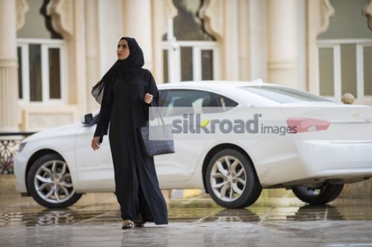 Arabian businesswoman walking|