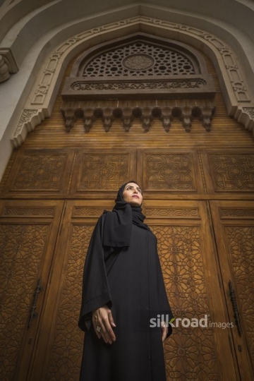 Middle Eastern Businesswoman dressed in the traditional attire|-