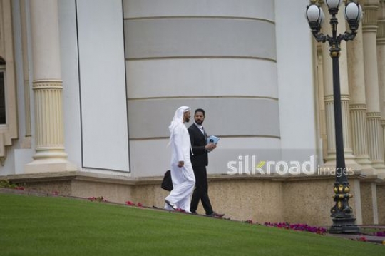 Businesspeople walking outside|-