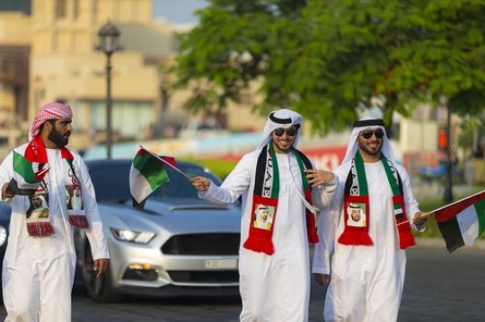 Arab men celebrating National Day|-