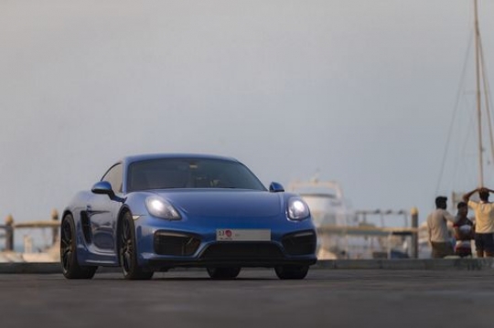 Man driving the blue colored car|-