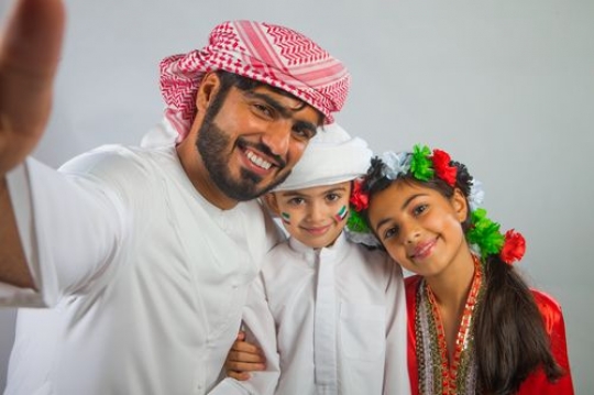 Portrait of a family taking a Selfie for National Day