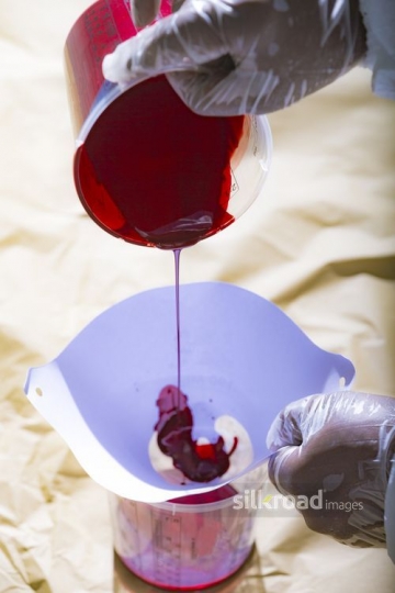 Auto Body Mechanic filling paint into the cup|-