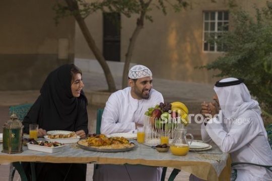 REPLACE - Arab family talking to each other during iftar|-