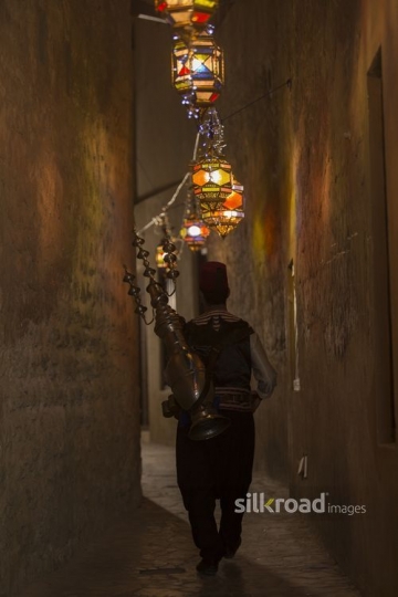 Middle Eastern Ramadan drink seller along the pathway|-