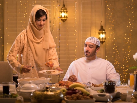 Wife serving meal for husband|-