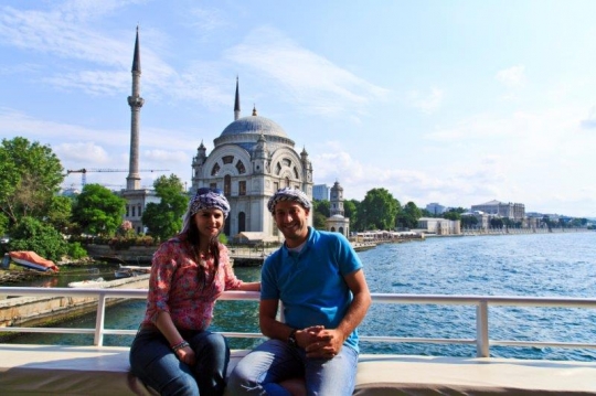 people taking photo in front o