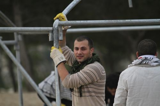 Palestinian demonstrators setting up tents at Bab al-Shams or Gate of the Sun in Palestine
