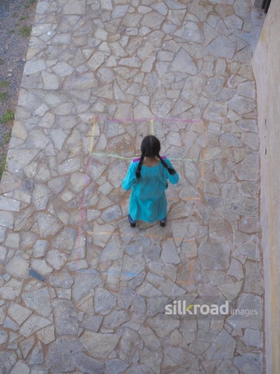 Girl jumping in the playground|-