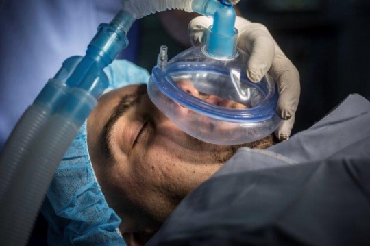 A Patient Under Anesthetic Face Mask