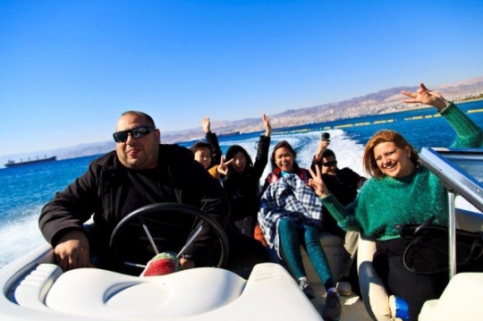 family enjoying the sea ride