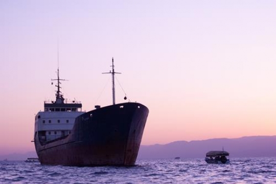 sunset view on the aqaba gulf and cargo ships